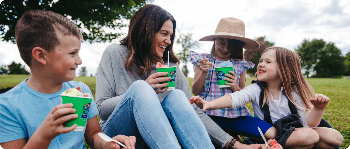 people outside eating shaved ice