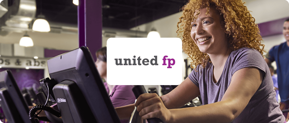 women riding eliptical